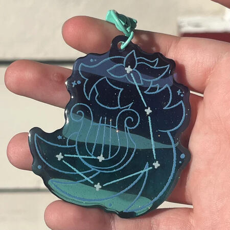 acrylic charm featuring the constellation of venti, the wind archon from genshin impact